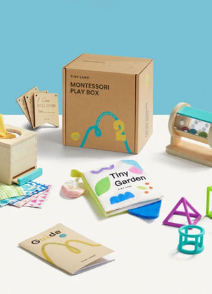 The Tiny Land® Montessori Complete Baby Set (0-24 months) includes sensory toys like a tissue box, spinning drum, textured cards, guidebooks, and geometric shapes—perfect for developing fine motor skills in infants.