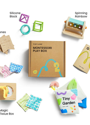 Flat lay of the Tiny Land® Montessori Complete Baby Set (0-24 months) with labeled items: silicone block, spinning rainbow, parent’s guide, cloth book, magic tissue box, milestone cards, and play mats—ideal for sensory and motor skill development.